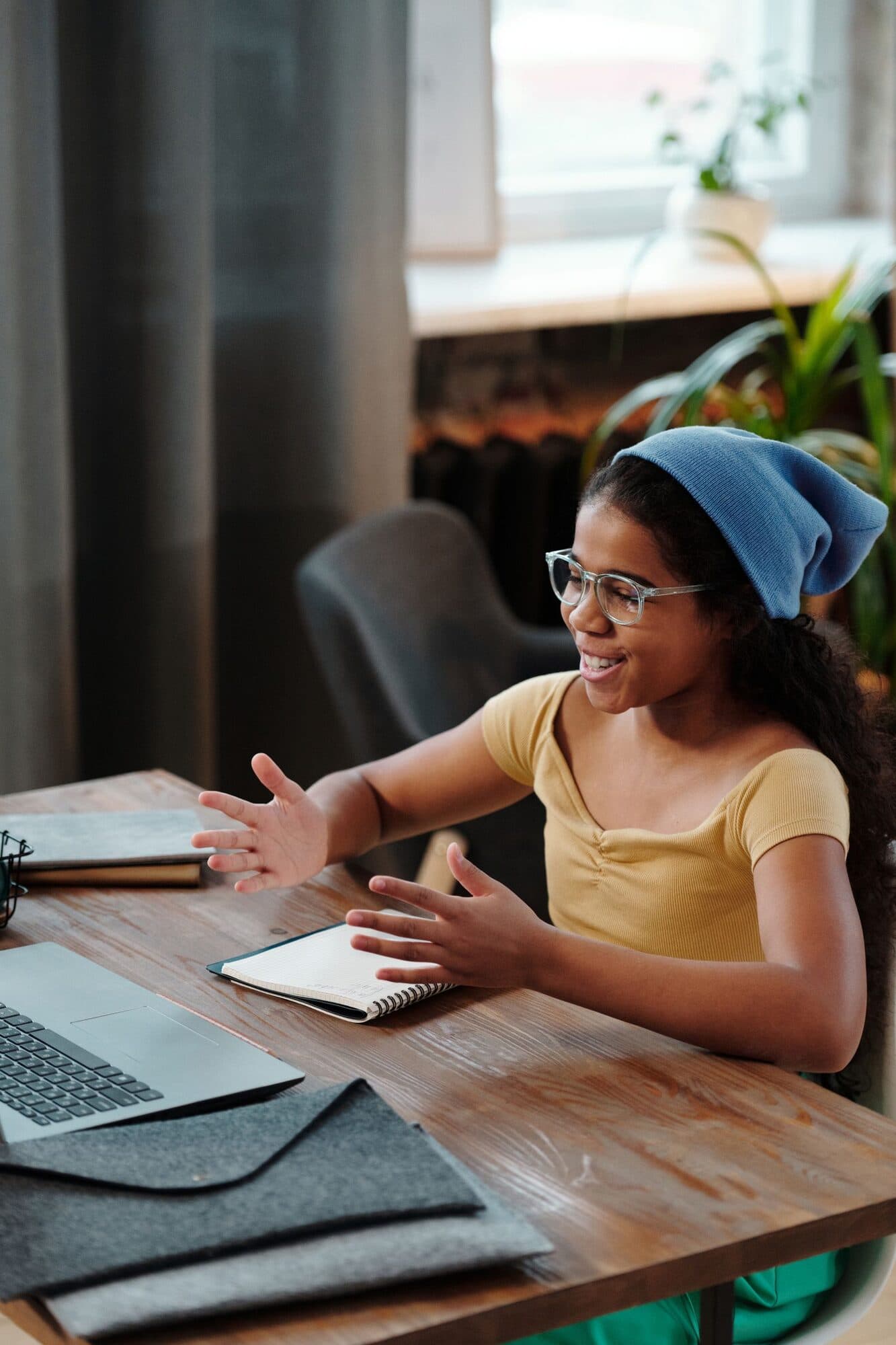 A secondary student talks with a tutor in a live lesson