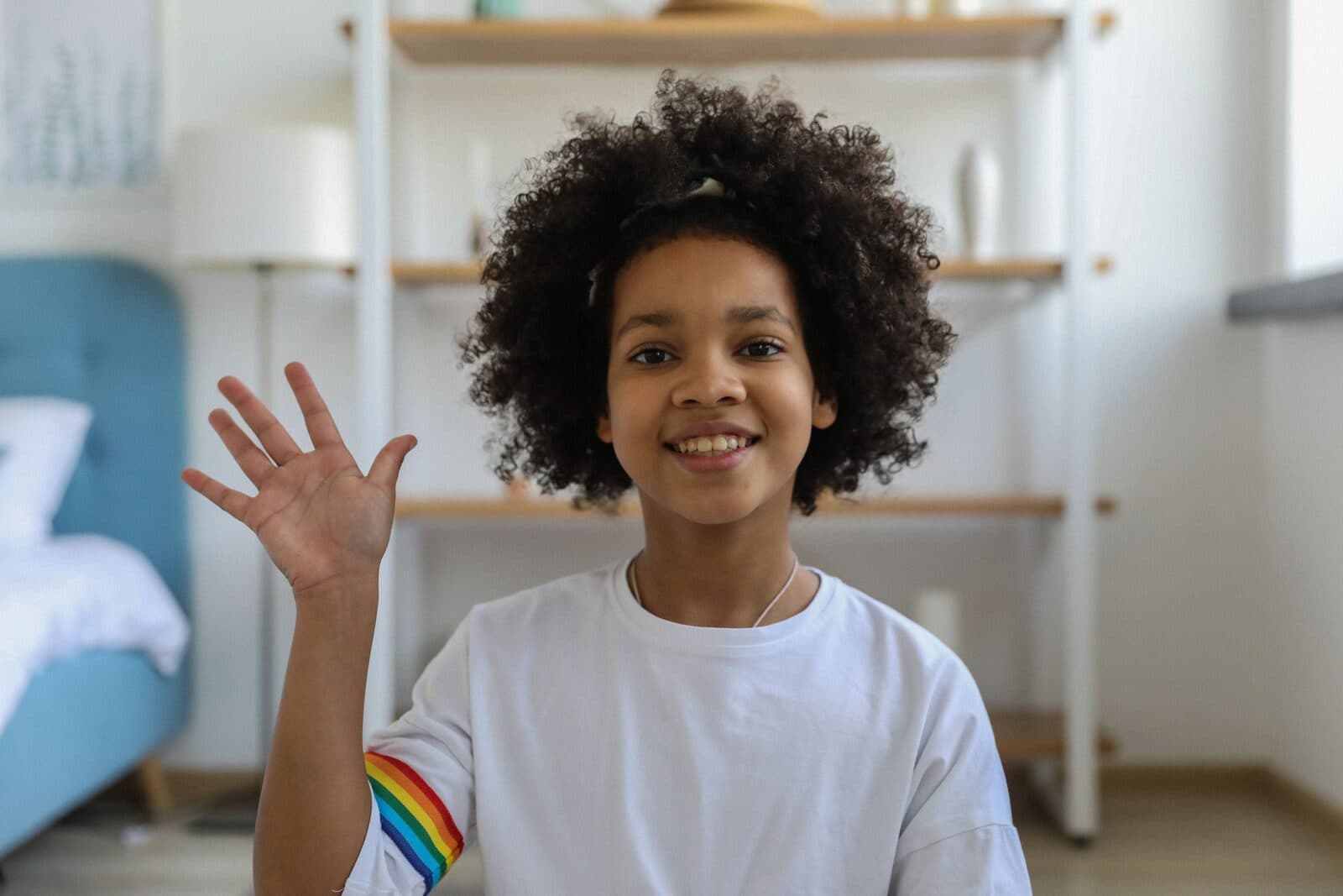 A learner waves hello at the start of a live lesson